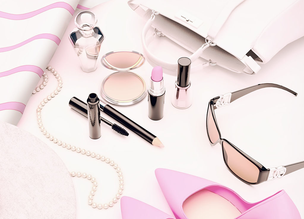 Set of cosmetics and various accessories for women on a white background.