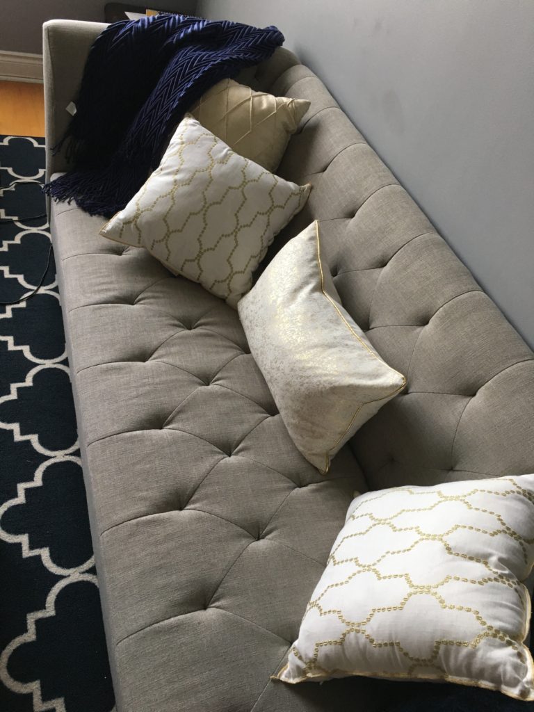 throw pillows and sofa gray gold white navy