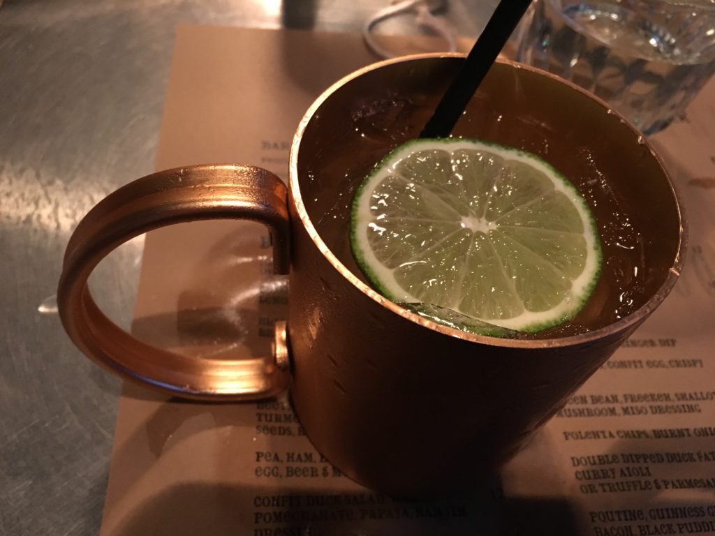 vodka and ginger beer in moscow mule cup at cleaver restaurant calgary